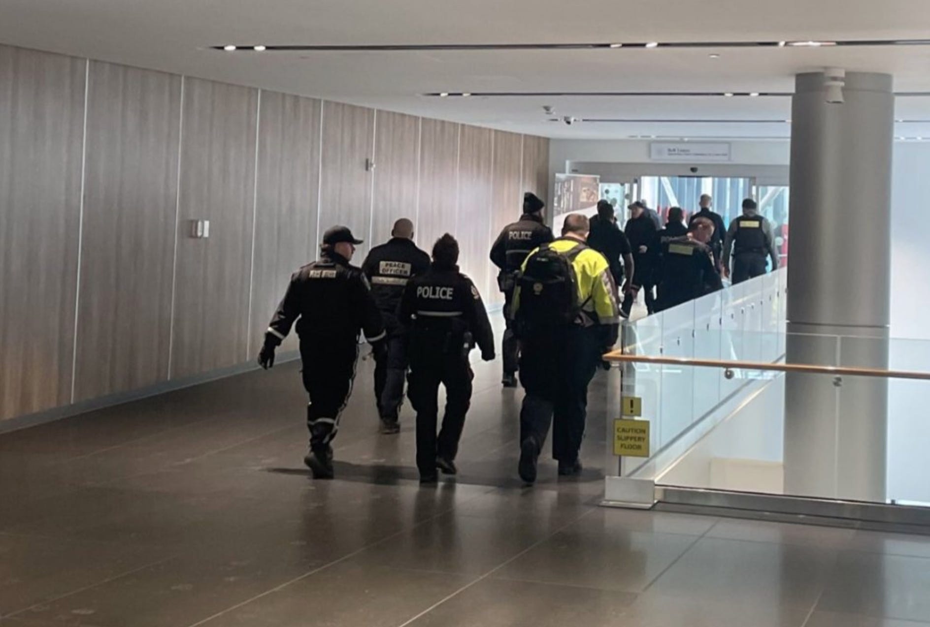 almost a dozen cops patrol the pedways in Edmonton's downtown, in a single group, making a show of force just a day after the provincial announcement. 